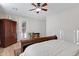 Bedroom with light walls, wood-look floors, and a glass door to a balcony at 19025 E Raven Dr, Queen Creek, AZ 85142