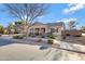 Beautiful single-Gathering home with desert landscaping, light-colored exterior, and a welcoming front porch at 19025 E Raven Dr, Queen Creek, AZ 85142