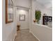 Hallway with decorative items, a mirror, and tile floors at 19025 E Raven Dr, Queen Creek, AZ 85142