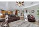 View of the living room leading to the kitchen with wood floors and modern decor at 19025 E Raven Dr, Queen Creek, AZ 85142