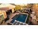 Inviting backyard pool area featuring a pergola with an outdoor seating, and patio with lounge chairs at 20551 E Mayberry Rd, Queen Creek, AZ 85142