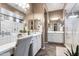 Bathroom with vanity, custom mirror, and an adjacent shower and walk-in closet at 20551 E Mayberry Rd, Queen Creek, AZ 85142