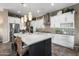 Bright kitchen features a large island with a white countertop and unique backsplash at 20551 E Mayberry Rd, Queen Creek, AZ 85142