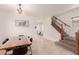 Open concept dining area with tile floors, modern chandelier, and a staircase view at 2075 S Ponderosa Dr, Gilbert, AZ 85295