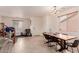 Inviting dining room features tile floors, a modern chandelier, and abundant natural light at 2075 S Ponderosa Dr, Gilbert, AZ 85295