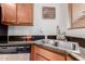 Close-up of a stainless steel sink with granite countertops, and a stainless steel dishwasher at 2075 S Ponderosa Dr, Gilbert, AZ 85295