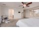 Carpeted main bedroom offering lots of natural light and an attached bathroom at 2075 S Ponderosa Dr, Gilbert, AZ 85295