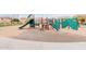 Large community playground with various play structures, including slides and climbing walls at 2075 S Ponderosa Dr, Gilbert, AZ 85295