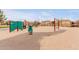 Community playground with climbing structures, swings, and plenty of room to run and play at 2075 S Ponderosa Dr, Gilbert, AZ 85295