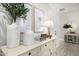 Inviting foyer area with a decorative table, vases, plants, and neutral decor at 21413 N 59Th St, Phoenix, AZ 85054