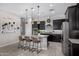 Modern kitchen with granite countertops, stainless steel appliances, and white subway tile backsplash at 21413 N 59Th St, Phoenix, AZ 85054