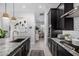 Well-lit kitchen with stainless steel appliances, granite countertops, and open layout at 21413 N 59Th St, Phoenix, AZ 85054