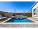 Inviting pool area with stone accents and a tranquil water feature at 21413 N 59Th St, Phoenix, AZ 85054