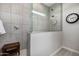 Elegant shower stall featuring gray tiling, a glass enclosure, and a built-in bench for comfort at 21413 N 59Th St, Phoenix, AZ 85054