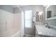 Bright bathroom features a shower-tub combo, marble countertop, and modern fixtures at 24431 N 35Th Dr, Glendale, AZ 85310