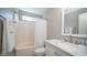 Updated bathroom with shower-tub combo, marble countertop, and modern fixtures at 24431 N 35Th Dr, Glendale, AZ 85310