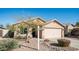 Single-story home featuring desert landscaping, a two-car garage, and a well-manicured lawn at 24431 N 35Th Dr, Glendale, AZ 85310