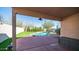 Covered patio view of the sparkling pool and low maintenance artificial turf yard at 24431 N 35Th Dr, Glendale, AZ 85310