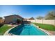 Sparkling pool, patio seating and a yard of lush artificial turf are yours to enjoy at 24431 N 35Th Dr, Glendale, AZ 85310