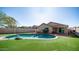 In-ground pool with easy care artificial grass is perfect for entertaining Gathering and friends at 24431 N 35Th Dr, Glendale, AZ 85310