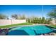 A refreshing in-ground pool surrounded by low maintenance artificial turf at 24431 N 35Th Dr, Glendale, AZ 85310