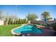 Inviting in-ground pool with well maintained artificial turf and lovely patio set at 24431 N 35Th Dr, Glendale, AZ 85310