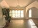 Elegant dining room with hardwood floors, chandelier, and natural light from large windows at 26637 S New Town Dr, Sun Lakes, AZ 85248
