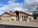 Stylish single-story home featuring desert landscaping, a three-car garage, and a tiled roof at 26637 S New Town Dr, Sun Lakes, AZ 85248