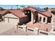 Charming single-story home featuring solar panels, desert landscaping, and a two-car garage at 26637 S New Town Dr, Sun Lakes, AZ 85248