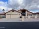 Charming single-story home with a three-car garage and well-maintained desert landscaping at 26637 S New Town Dr, Sun Lakes, AZ 85248