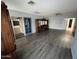 Open living room boasts wood-look floors, neutral walls, and plenty of space for comfortable furniture at 26637 S New Town Dr, Sun Lakes, AZ 85248