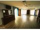 Large main bedroom with hardwood floors, blue accent wall, and multiple windows for natural light at 26637 S New Town Dr, Sun Lakes, AZ 85248