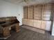 A home office featuring a built-in bookshelf and storage cabinet, along with an antique wooden desk at 26637 S New Town Dr, Sun Lakes, AZ 85248