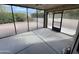 Enclosed patio with concrete floor, ceiling fan, and backyard views at 26637 S New Town Dr, Sun Lakes, AZ 85248