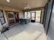 Enclosed patio with a hot tub, ceiling fan, and access to the backyard at 26637 S New Town Dr, Sun Lakes, AZ 85248