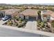 Aerial view of a well-maintained home with desert landscaping, a two-car garage, and a tile roof at 29588 N 129Th Dr, Peoria, AZ 85383