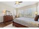 Bright bedroom with plantation shutters and hardwood floors at 29588 N 129Th Dr, Peoria, AZ 85383