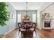 Elegant dining room with a wooden table, chandelier, and stylish décor at 29588 N 129Th Dr, Peoria, AZ 85383