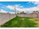 Expansive backyard with block fence and partial lawn, ideal for relaxation or entertainment at 3009 W Alice Ave, Phoenix, AZ 85051