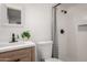 Modern bathroom features a new vanity, sleek fixtures, and a stylish shower with white subway tile at 3009 W Alice Ave, Phoenix, AZ 85051