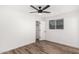 Spacious bedroom featuring contemporary flooring, natural light, and closet space at 3009 W Alice Ave, Phoenix, AZ 85051