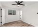 Bedroom features contemporary flooring, large window, and ample natural light at 3009 W Alice Ave, Phoenix, AZ 85051