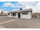 Charming renovated single-story home with crisp white paint, black trim, and xeriscaped yard at 3009 W Alice Ave, Phoenix, AZ 85051