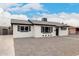 Charming renovated single-story home with crisp white paint, black trim, and xeriscaped yard at 3009 W Alice Ave, Phoenix, AZ 85051