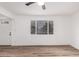 Bright Living room with wood flooring, white walls, and large window at 3009 W Alice Ave, Phoenix, AZ 85051