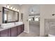 Stylish bathroom featuring double sinks, stone countertops, and a neutral color palette at 318 E Gail Dr, Gilbert, AZ 85296