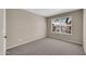 Well-lit bedroom with neutral walls and plush carpeting at 318 E Gail Dr, Gilbert, AZ 85296