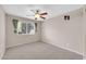 Bedroom featuring a ceiling fan, neutral walls and carpet at 318 E Gail Dr, Gilbert, AZ 85296