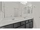 This bathroom features a double vanity, a large mirror, and recessed lighting at 3263 S Miller Dr, Chandler, AZ 85286