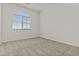 This bedroom has neutral carpet, a window with blinds, and plenty of natural light at 3263 S Miller Dr, Chandler, AZ 85286